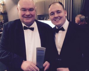 John Morrey, winner of Outstanding Contribution by an Individual, with Captive Review editor Richard Cutcher.